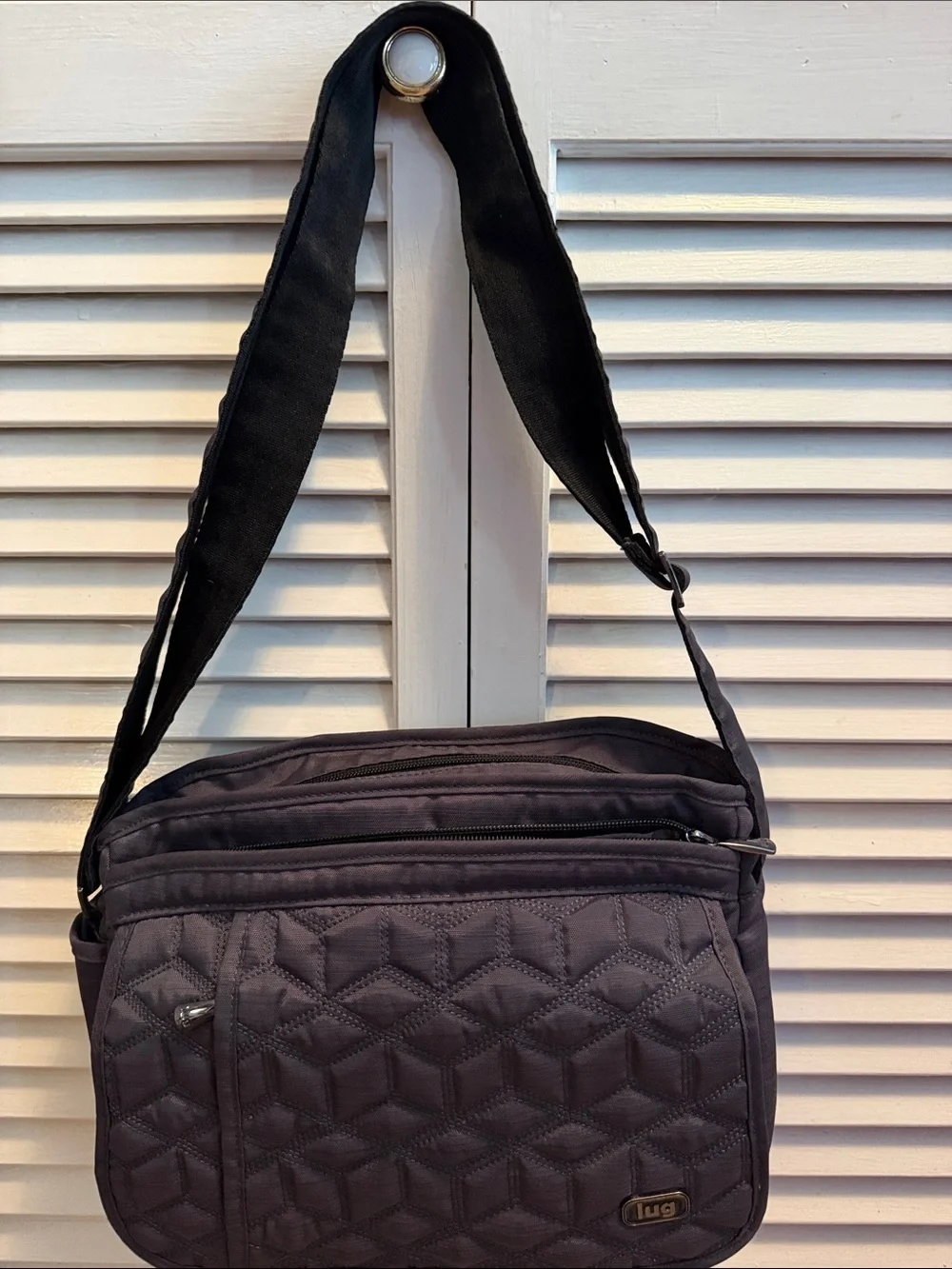 Lug Quilted Messenger Crossbody Bag in Black